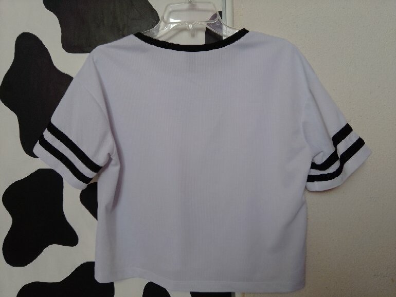 Playera blanca y negro de Cuidado Con El Perro de segunda mano