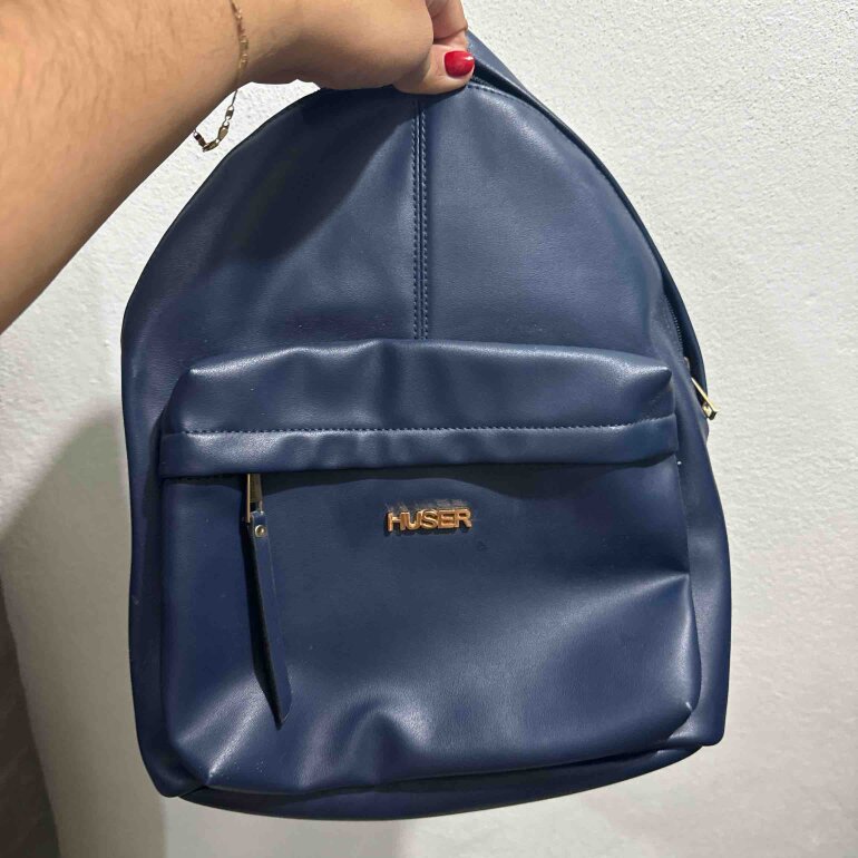Mochila azul marca huser como nueva de segunda mano GoTrendier